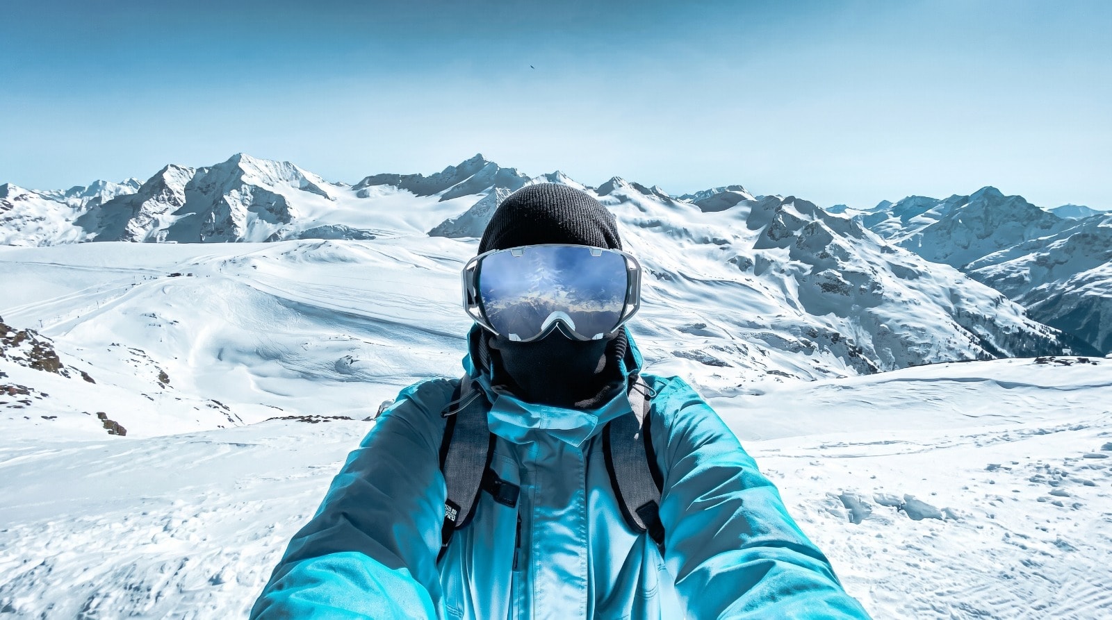 Mountaineer with Ski Goggles overlooking Himalayas